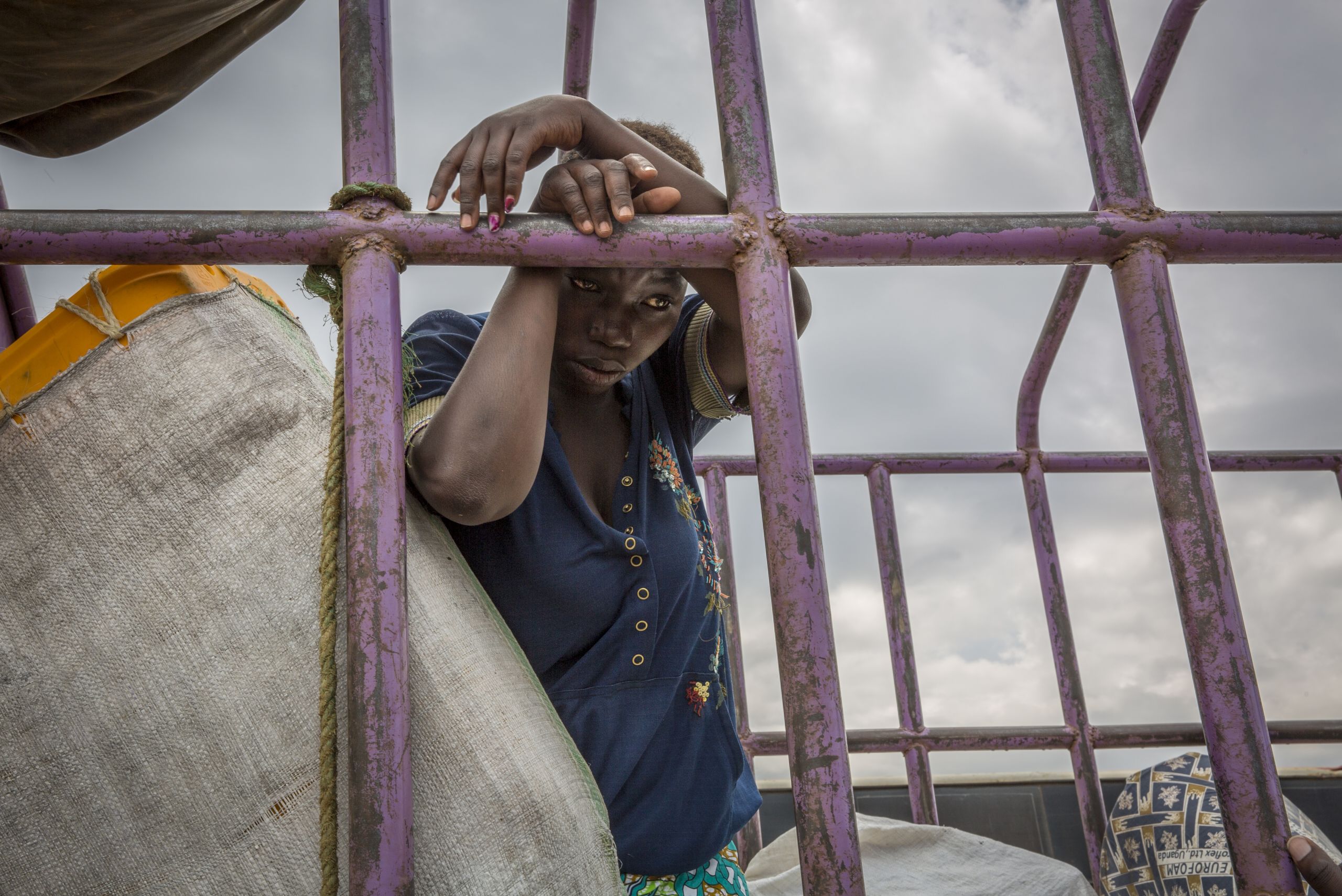 Esake, 27, is troubled because she has not eaten food for the last 24 hours. She has run out of money yet she has not yet been registered as a refugee after she fled DR Congo across Lake Albert into Uganda. Photo: Ingebjørg Kårstad/NRC
